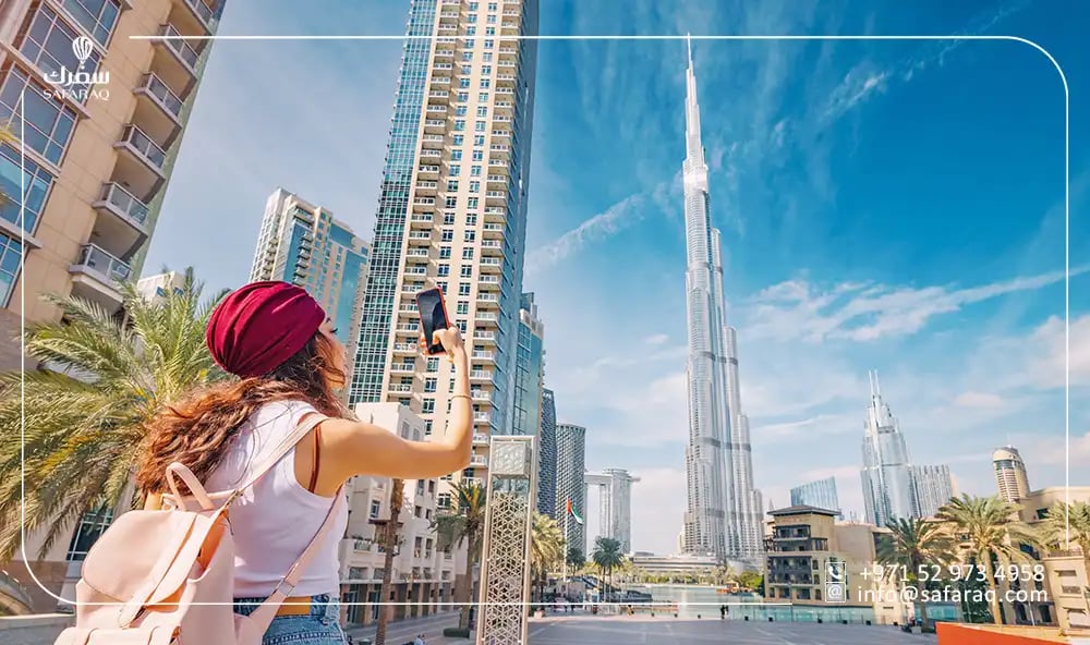 tourist in Dubai taking a picture of Burj Khalifa