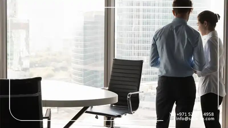 two people in a meeting room in Dubai