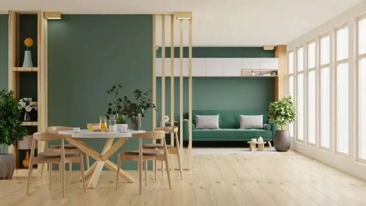 green sofa and dining room interior