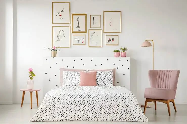 Feminine bedroom interior with a wall art